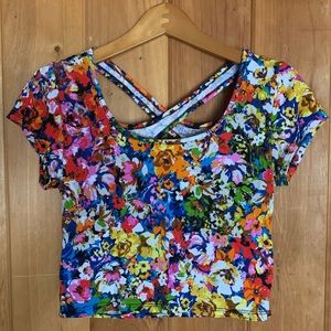 New with tags. Floral crop top with open back.